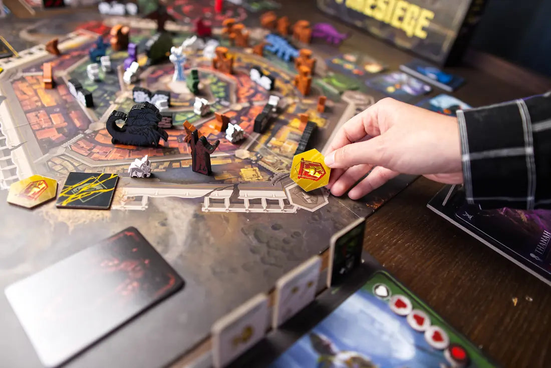 A player slots a command tile into a hero board